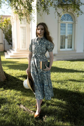 a lady in a floral printed tiered women midi dress